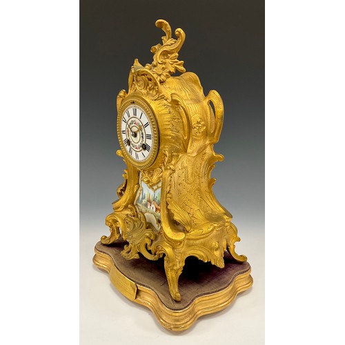 1715 - A 19th century French Ormolu and porcelain mantel clock, floral dial, Roman numerals, above landscap... 