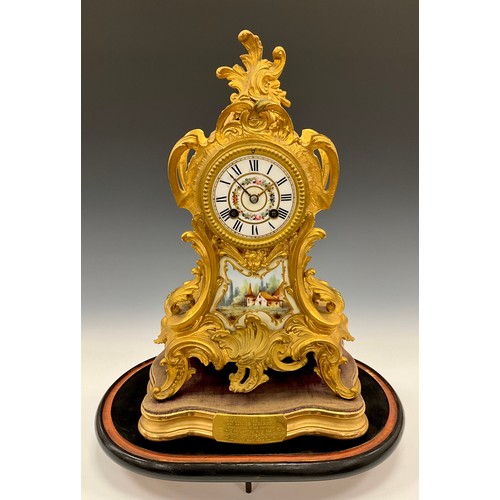 1715 - A 19th century French Ormolu and porcelain mantel clock, floral dial, Roman numerals, above landscap... 