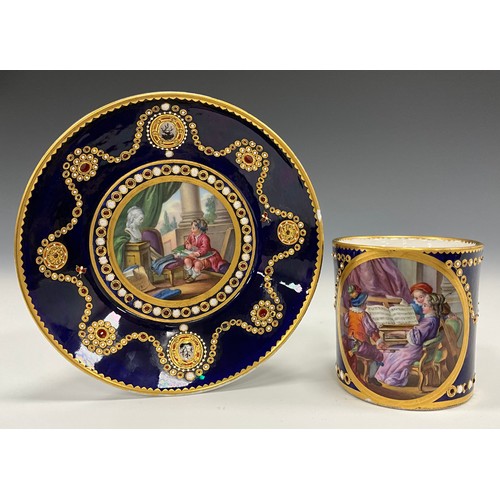 1352 - An 18th century Sevres porcelain cabinet cup and saucer, the cup vignette with child musicians with ... 