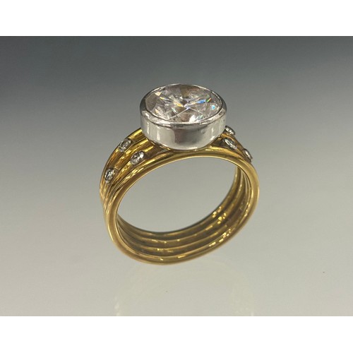 612 - A Nicholas Wylde diamond and white stone dress ring, principle white stone, possibly a sapphire whit... 