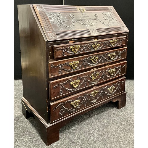 1738 - A George III mahogany bureau, with later neo-classical carved fall door, and drawer fronts, the hing... 