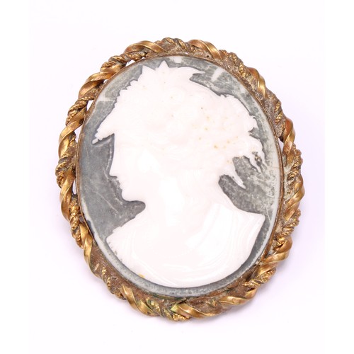 689 - An early 19th century gold mounted carved shell cameo brooch, carved as the goddess Hebe with cup an... 