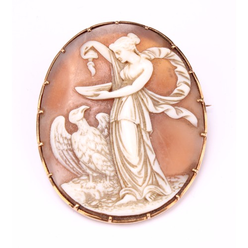 689 - An early 19th century gold mounted carved shell cameo brooch, carved as the goddess Hebe with cup an... 