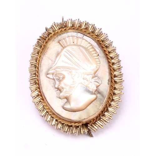 689 - An early 19th century gold mounted carved shell cameo brooch, carved as the goddess Hebe with cup an... 