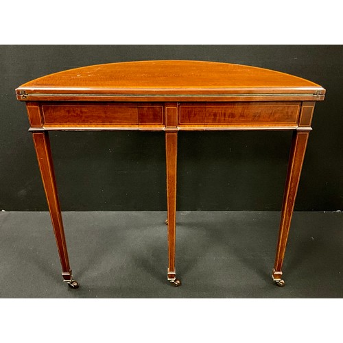 1603 - A George III mahogany Demi-lune shaped card table, the satinwood cross-banded top lifting up and ove... 