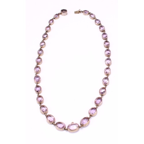 655 - A single strand necklace of silver mounted graduated faceted pale amethysts, the clasp marked 800, 4... 