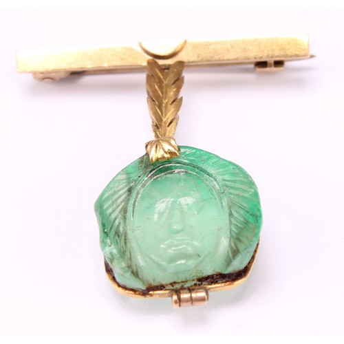 679 - Alfred Lyndhurst Pocock (1882 - 1962), an 18ct gold mounted emerald intaglio brooch, carved as the f... 