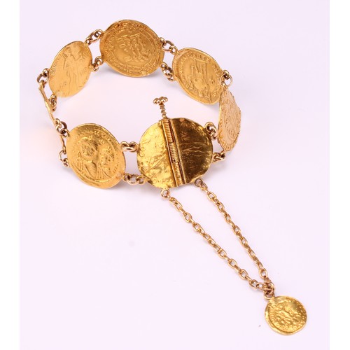 601 - A high carat gold bracelet, containing an arrangement of seven Byzantine and other similar gold coin... 