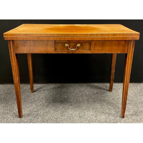 1770 - A George III mahogany tea-table, rectangular fold-over top, with single small frieze drawer tapered ... 