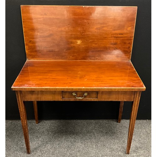 1770 - A George III mahogany tea-table, rectangular fold-over top, with single small frieze drawer tapered ... 