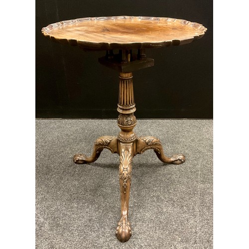 1688 - A George III Revival tilt-top bird-cage tripod table, the shaped top supported by a fluted, tapering... 