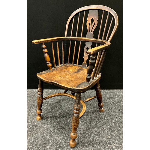 1570 - An early 19th century elm Windsor chair, crinoline stretcher, 93cm high, 47.5cm wide; a small elm Wi... 