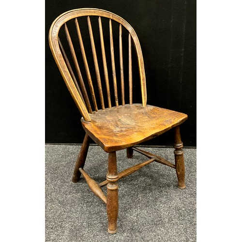 1570 - An early 19th century elm Windsor chair, crinoline stretcher, 93cm high, 47.5cm wide; a small elm Wi... 