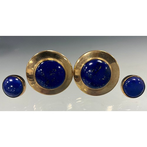 627 - A pair of lapis lazuli 9ct gold mounted circular earrings, veined cabochon centres, 21mm diameter, a... 