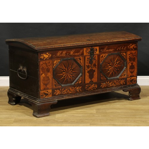 1525 - A 17th century German oak and marquetry chest, hinged domed cover enclosing a till and secret compar... 