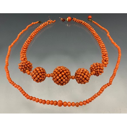 637 - A pink coral bead graduated five ball necklace, 43cm long, graduated single strand necklace, 49cm lo... 