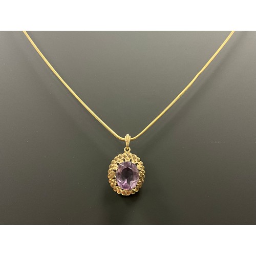 685 - An amethyst pendant necklace, oval pale pinky purple amethyst within textured 9ct gold mount 3.8g, s... 