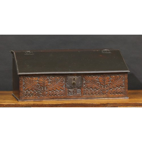 1630 - An 18th century oak boarded table box, hinged sloping cover enclosing four small drawers, the front ... 