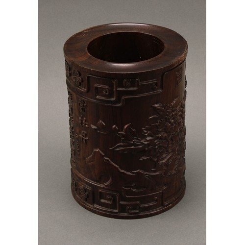 1398 - A Chinese hardwood scholar's bitong brush pot,  carved in relief with phoenix, flowers, trellis, pru... 