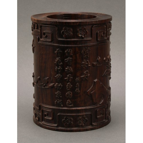 1398 - A Chinese hardwood scholar's bitong brush pot,  carved in relief with phoenix, flowers, trellis, pru... 