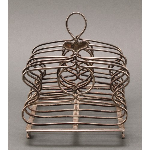 362 - A George IV silver seven bar toast rack, loop handle, whiplash divisions, acanthus, rose and paw fee... 