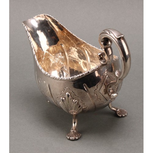 122 - A George III Irish silver sauce boat, of substantial gauge, acanthus-capped scroll handle, gadrooned... 