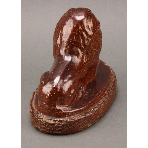 1259 - A 19th century brown salt glazed stone ware model, of a recumbent lion, oval base, 16.5cm wide