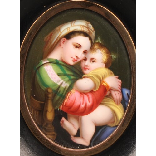 2024 - A Continental porcelain plaque, painted after Raphael with the Madonna della Seggiola, oval, 7.5cm x... 