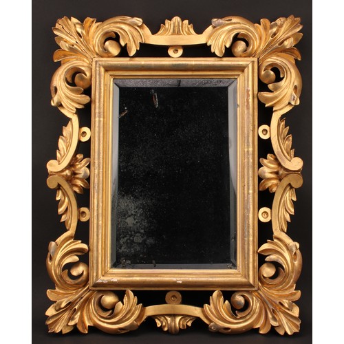 1798 - A 19th century giltwood looking glass, pierced and carved in the Baroque taste, bevelled mirror plat... 