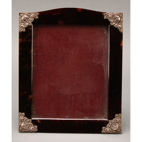 460 - An early 20th century silver coloured metal mounted tortoiseshell easel photograph frame, serpentine... 