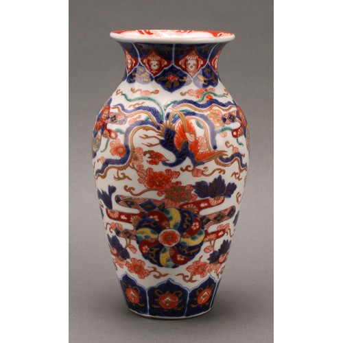 1410 - A Japanese ovoid vase, painted in the Imari palette with phoenix, flowers, leaves and auspicious sym... 