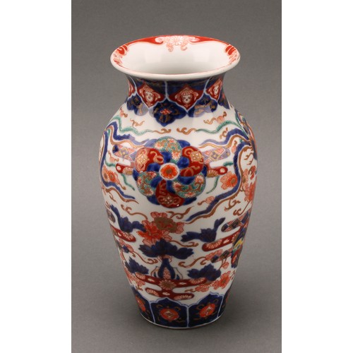 1410 - A Japanese ovoid vase, painted in the Imari palette with phoenix, flowers, leaves and auspicious sym... 