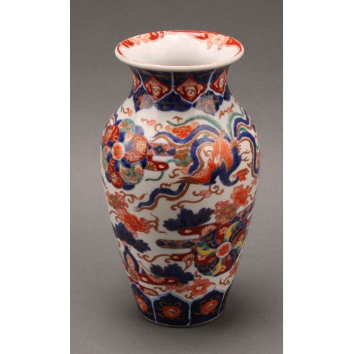 1410 - A Japanese ovoid vase, painted in the Imari palette with phoenix, flowers, leaves and auspicious sym... 