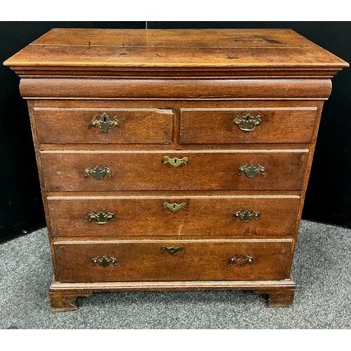 1777 - A George III oak chest of drawers, the slightly oversailing top with moulded edge, and single long h... 