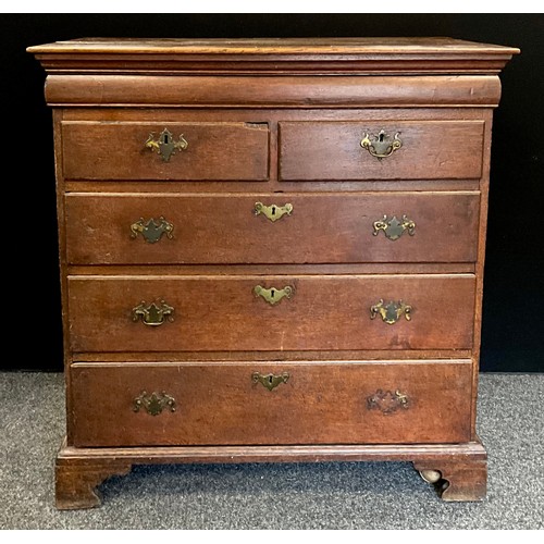 1777 - A George III oak chest of drawers, the slightly oversailing top with moulded edge, and single long h... 