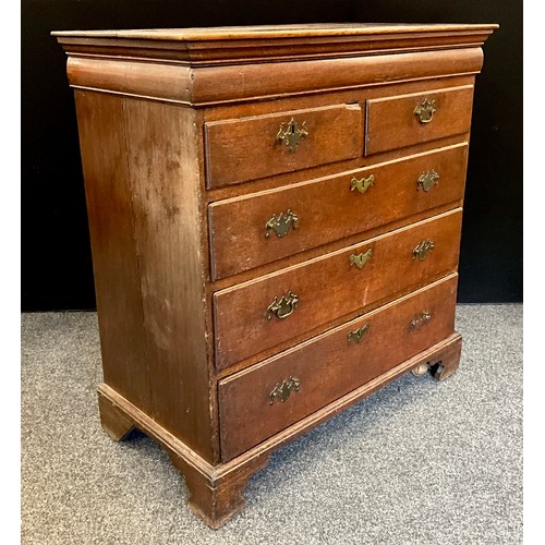 1777 - A George III oak chest of drawers, the slightly oversailing top with moulded edge, and single long h... 