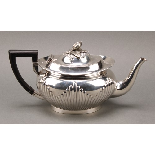 316 - A Victorian silver half-fluted lamp shaped teapot, acorn finial above hinged cover, angled handle, f... 