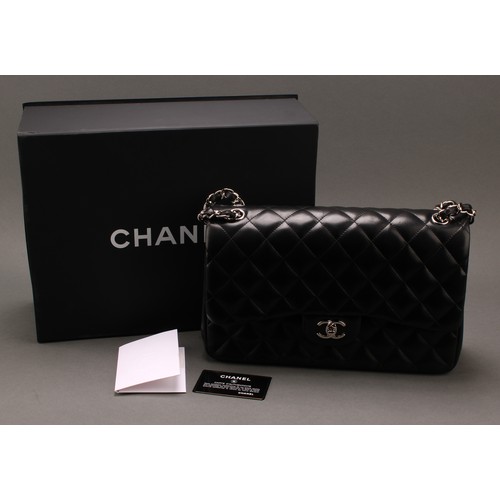 2014 - A Chanel quilted black leather Jumbo Classic handbag, interlacing double C monogram in silver, faste... 