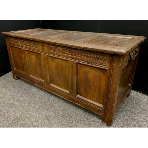 1526 - A 17th century oak four panel blanket box coffer, named HENRY MELLOR 1677,  hinged lid, carved friez... 