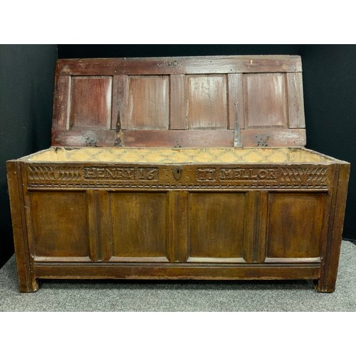 1526 - A 17th century oak four panel blanket box coffer, named HENRY MELLOR 1677,  hinged lid, carved friez... 