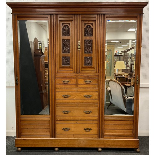 1619 - A Victorian carved walnut wardrobe, moulded cornice, above a central linen-press section, with carve... 