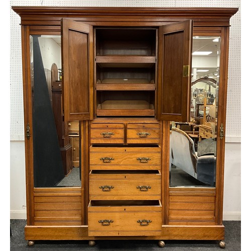 1619 - A Victorian carved walnut wardrobe, moulded cornice, above a central linen-press section, with carve... 