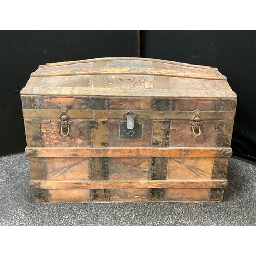 1586 - A 19th century dome top travelling trunk, with original fitted interior, 67cm high x 92cm x 50.5cm.