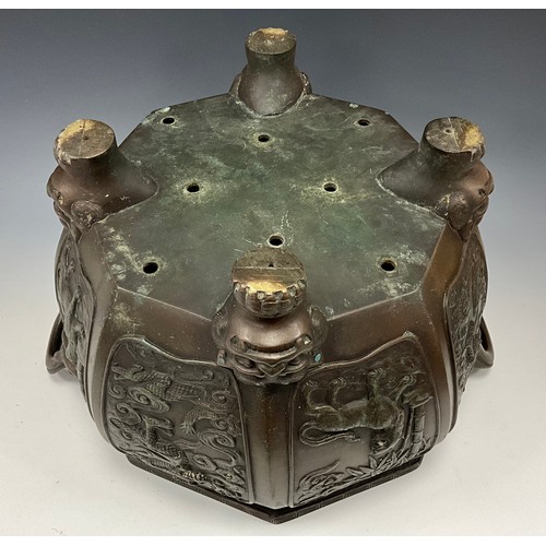 1416 - A Japanese bronze Hibachi jardiniere, twin handled octagonal form, relief cast with alternating pane... 