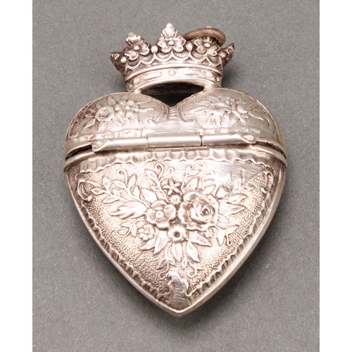 307 - A Danish silver coloured metal heart shaped hovedvandsaeg marriage box, chased with flowers and leav... 