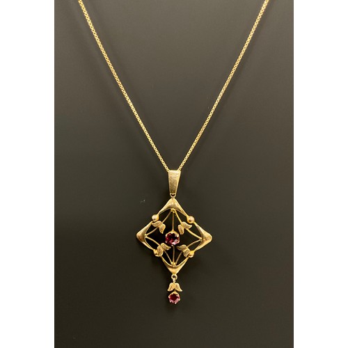 688 - An Art Nouveau garnet pendant necklace, lobbed square frame set with two red pink garnets, stamped 9... 