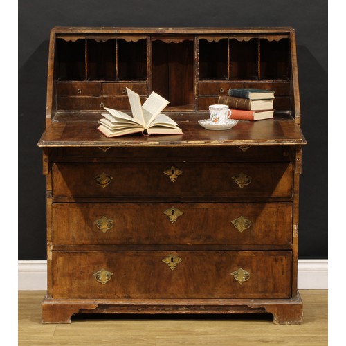 1538 - A George II crossbanded walnut bureau, fall front enclosing a fitted interior, above four long gradu... 