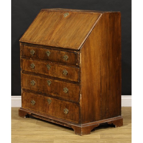 1538 - A George II crossbanded walnut bureau, fall front enclosing a fitted interior, above four long gradu... 