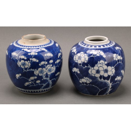 1405 - A Chinese ovoid ginger jar, painted in tones of underglaze blue with prunus on a ground of cracked i... 