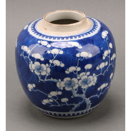 1405 - A Chinese ovoid ginger jar, painted in tones of underglaze blue with prunus on a ground of cracked i... 